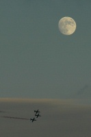 Patriot flying team flying under moon at Miramar Air Show-1 10-5-05
