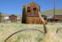 Weathered wheel rim and buildings at Bodie 6-8-07