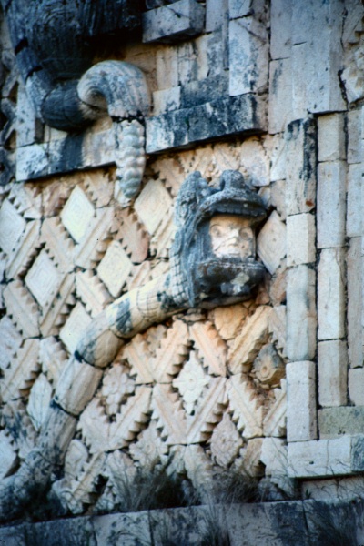 Mans head in serpents mouth on Nunnery at Uxmal Mexico 12-81
