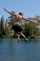 Brett jumping off rock into Long Lake near Serene Lakes-08-3 7-29-07