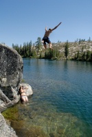 Shannon photographing Brett jumping off rock into Long Lake near Serene Lakes-02 7-29-07