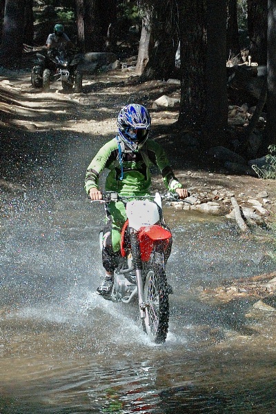 Brett crossing creek on dirt bike near Serene Lakes-03-2 7-31-07