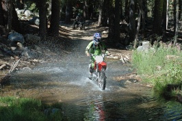 Brett crossing creek on dirt bike near Serene Lakes-03 7-31-07