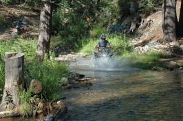 Craig Martens riding ATV across stream near Cascade Lake near Serene Lakes-01 8-4-07