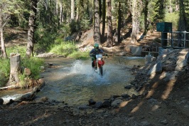 Eric Dahlstrom riding dirt bike across stream near Cascade Lake near Serene Lakes-02 8-4-07