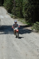 Craig Martens riding dirt bike down old Soda Springs Rd near Serene Lakes-12 8-5-07