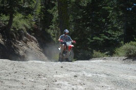 Craig Martens riding dirt bike down old Soda Springs Rd near Serene Lakes-15 8-5-07