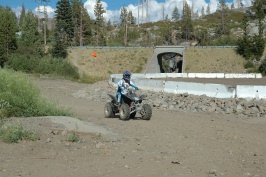 LC riding ATV at entrance to snow sheds at Donner Pass-02 8-8-07