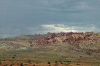 QJY-Thunder clouds over rock formations at Arches Nat Park UT 9-3-05