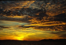 Sun setting over Goden Gate bridge