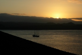 Sun setting behind Alta in Sullivan Bay at Bartholome island-Galapagos-2 8-4-04