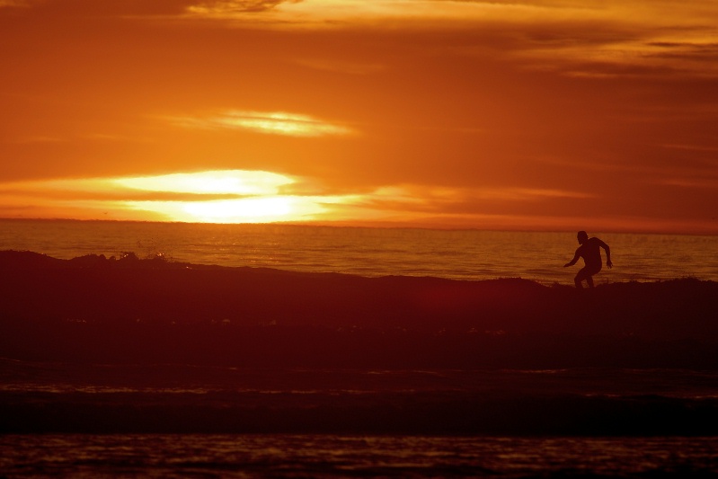Surfer at sunset at Swamis in Encinitas-26 2-17-07