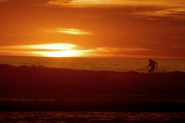 Surfer at sunset at Swamis in Encinitas-26 2-17-07